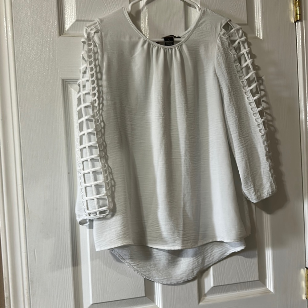 White flowy and breezy blouse with arm accents